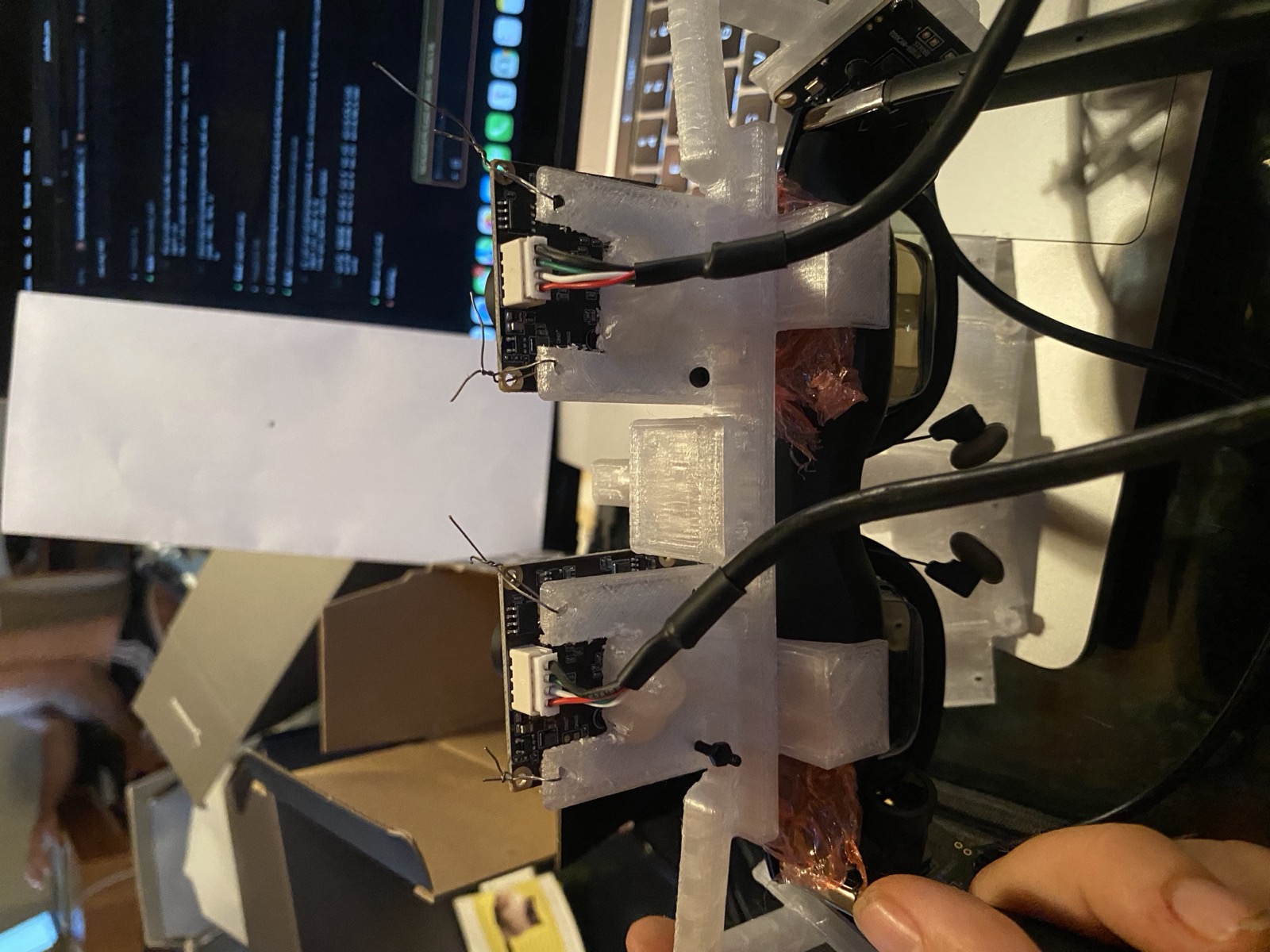 The four-camera bank wired up on the bench in front of a laptop